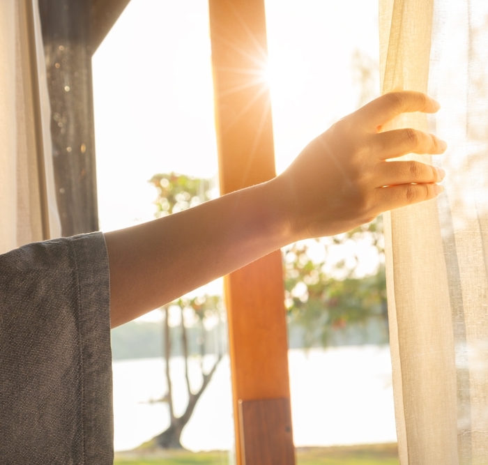 Woman's,Hand,She,Opened,The,Curtains,On,The,Window.,There