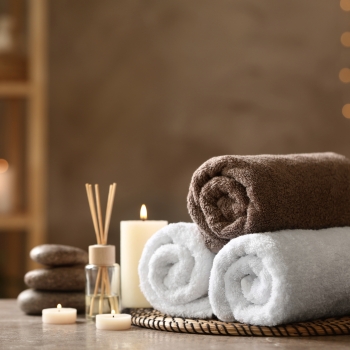 Beautiful,Composition,With,Spa,Stones,On,Grey,Marble,Table